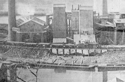 Morris Canal, next to factory and railroad tracks with train, circa 1900, Morris County, NJ (MC080)